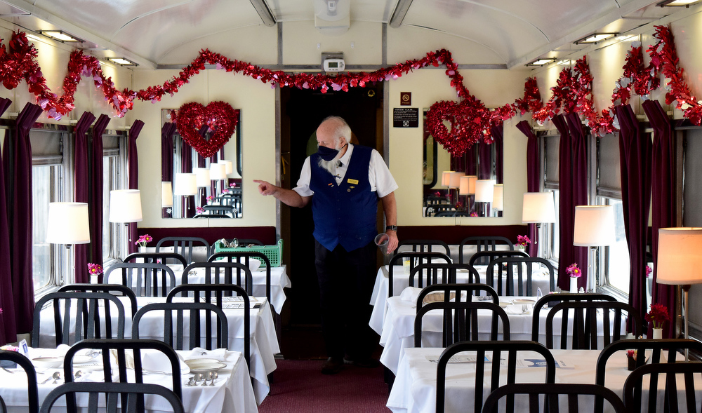 Staff Photo by Robin Rudd / Steward Rob Ralph checks on the condition of the dining car, Traveler's Rest.
