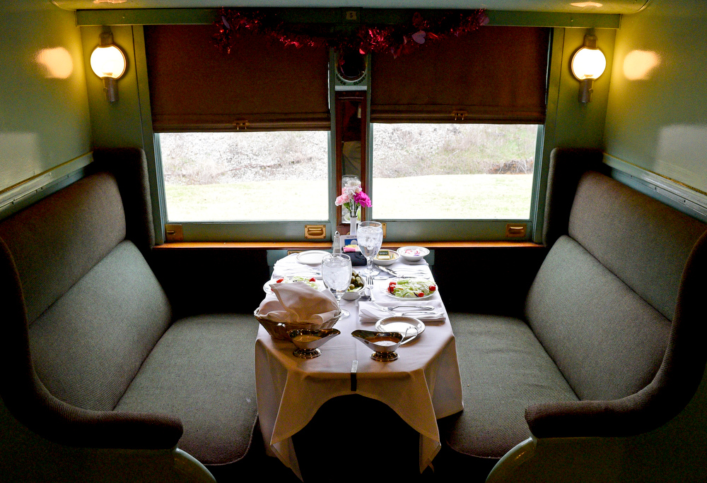 Staff Photo by Robin Rudd / The historic elegance of rail travel is displayed in this table setting in the first class car, Clover Colony.