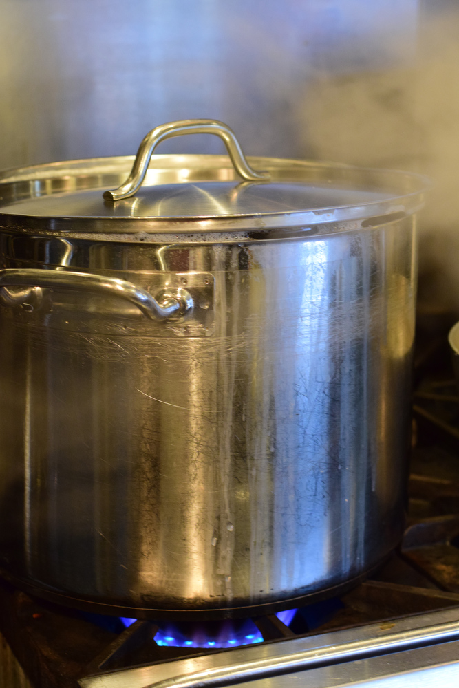 Staff Photo by Robin Rudd / A pot of potatoes boils on the gas stove.