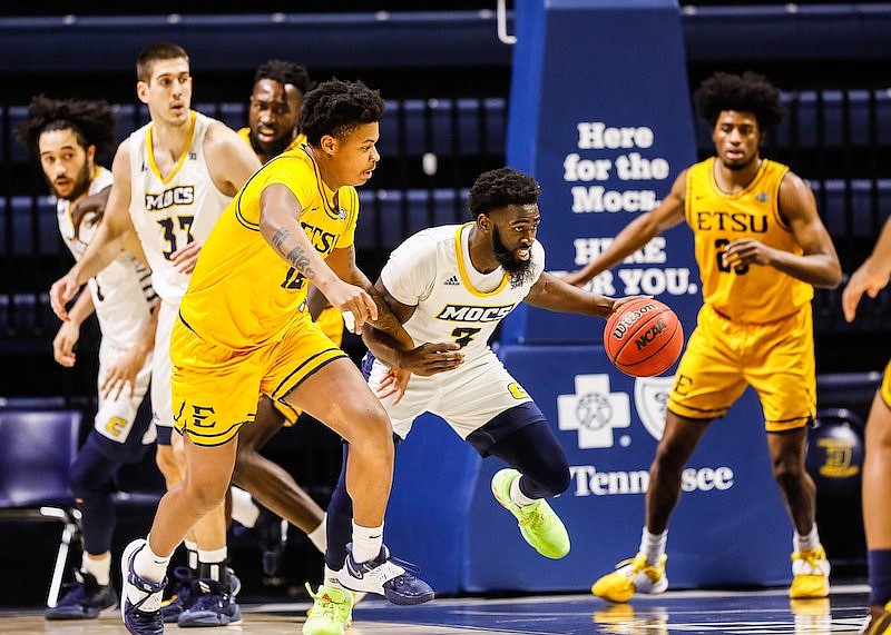 Staff photo by Troy Stolt / Chattanooga Mocs guard David Jean-Baptiste (3) grabs a defensive rebound during the basketball game between the University of Tennessee and the East Tennessee State Buccaneers at McKenzie Arena on Monday, Feb. 15, 2021, in Chattanooga, Tenn.