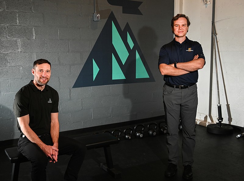Nicholas Boer, who teaches exercise physiology at UTC, (right), is an advisor to the Onsight Fitness center in the Dome Building on Georgia Avenue. Josh Johann, left, is one of the founders of the business. University of Tennessee at Chattanooga photo by Angela Foster.