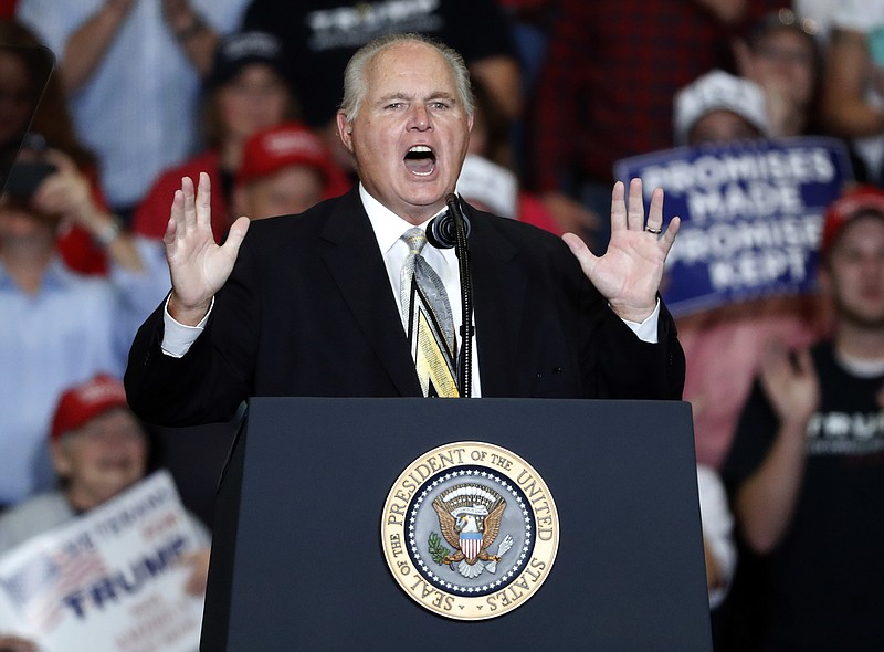 Associated Press File Photo / Radio talk show host Rush Limbaugh introduces then-President Donald Trump at the start of a rally in Cape Girardeau, Missouri, in 2018.