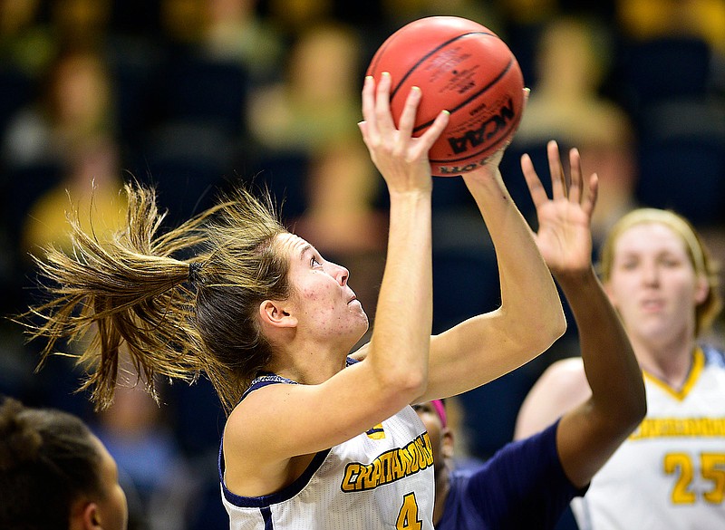 Staff photo by Robin Rudd /  UTC's Anna Walker drives to the basket during Friday's home game against UNC Greensboro. UTC won 57-41.