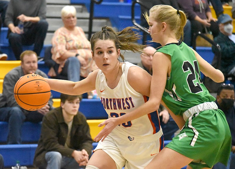 Staff photo by Matt Hamilton / Northwest Whitfield's McKenzie Brueckner dribbles while guarded by Cassidy Richards during the Lady Bruins' home game against Pickens on Friday night in Tunnel Hill, Ga. With the GHSA Region 7-AAAA girls' basketball title on the line, Northwest came up short in a 56-42 loss.