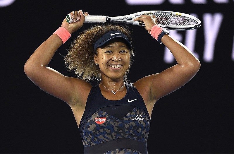 AP photo by Andy Brownbill / Naomi Osaka smiles after defeating Jennifer Brady to win the Australian Open for the second time and her fourth major championship overall Saturday at Melbourne Park.
