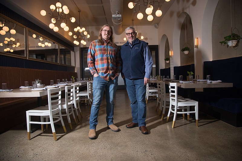 Staff photo by Troy Stolt / Barry and Matt Jeffery pose for a portrait inside of Easy Bistro, where their company Chattanooga Floor Care and Sanitizing installed the floor.