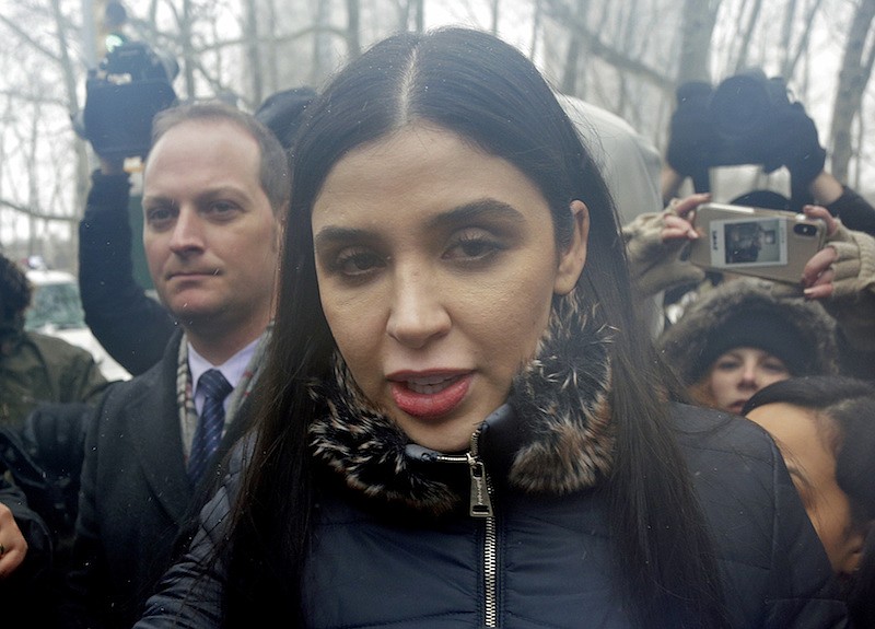 In this Feb. 12, 2019 file photo, Emma Coronel Aispuro, center, wife of Joaquin "El Chapo" Guzman, leaves federal court in New York. The wife of Mexican drug kingpin and escape artist Joaquin "El Chapo" Guzman has been arrested on international drug trafficking charges at an airport in Virginia. The Justice Department says 31-year-old Emma Coronel Aispuro, who is a dual citizen of the U.S. and Mexico, was arrested at Dulles International Airport on Monday and is expected to appear in federal court in Washington on Tuesday. (AP Photo/Seth Wenig)