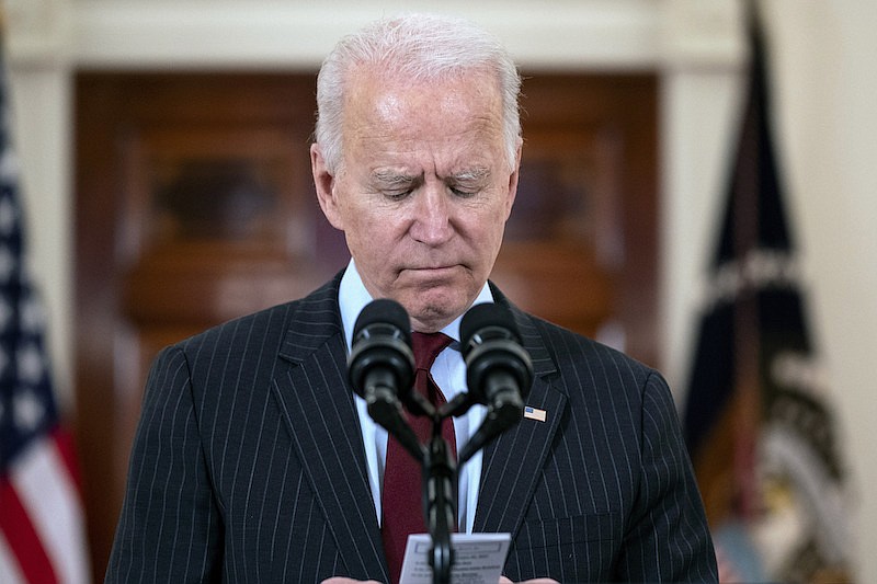 President Joe Biden reads the number of American that died from COVID-19 during a speech at the White House, Monday, Feb. 22, 2021, in Washington. (AP Photo/Evan Vucci)