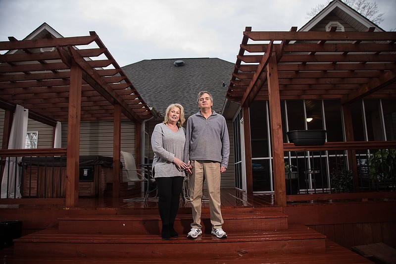 Staff photo by Troy Stolt / Andy and Beth Coradini pose for a portrait on their back deck on Wednesday, Jan. 27, 2021 in Soddy Daisy, Tenn.