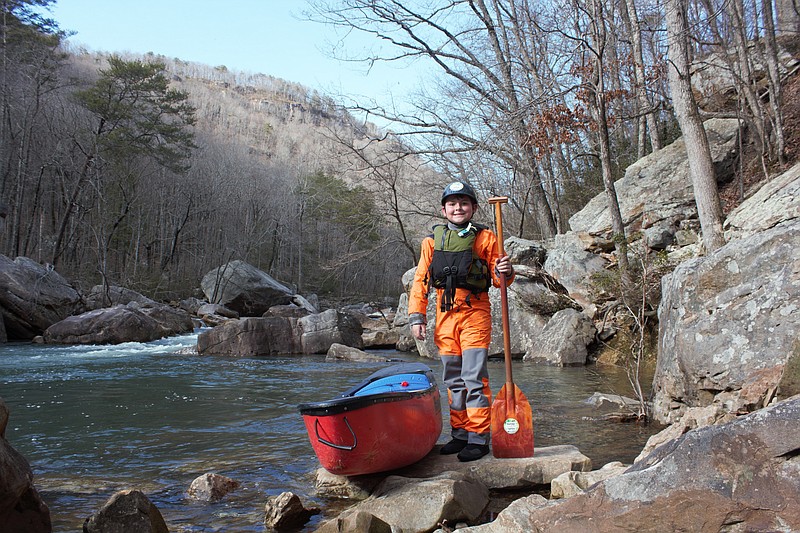 Photo contributed by Sunny Montgomery / Jack Guin stands alongside the North Chickamauga Creek in Soddy-Daisy. The 10-year-old claimed his pfd, or personal first descent, of the Class III/IV run in November 2020.