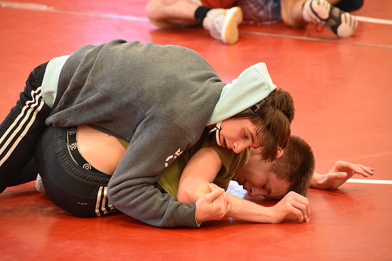 Staff photo by Patrick MacCoon / Eighth grader Ethan Uhorchuk (top) wrestles with teammate and brother Caleb Uhorchuk who is a sophomore for the Eagles. Caleb and his older brother Daniel each won individual state championships last season for Signal Mountain.