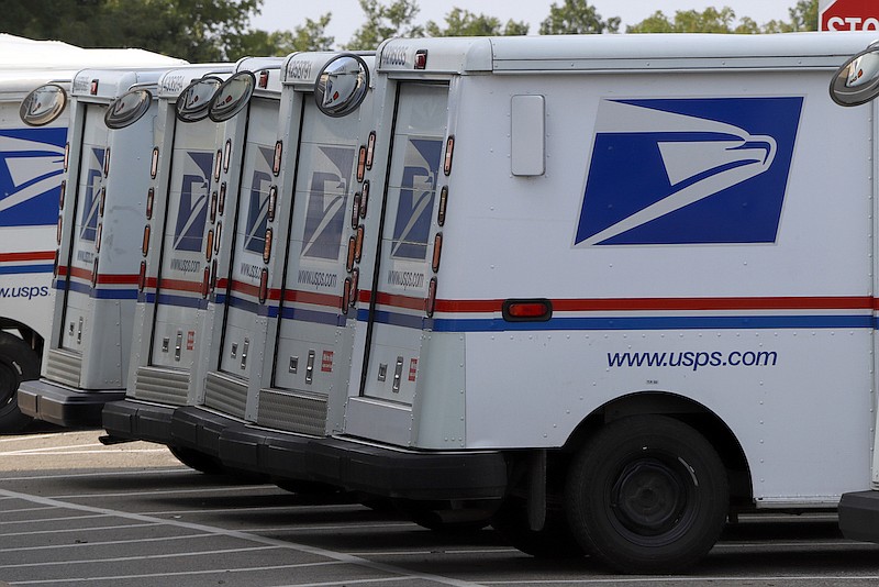 Postal delivery trucks are parked at the United States Post Office in Cranberry Township, Pa., on August 26, 2020. (AP Photo/Gene J. Puskar