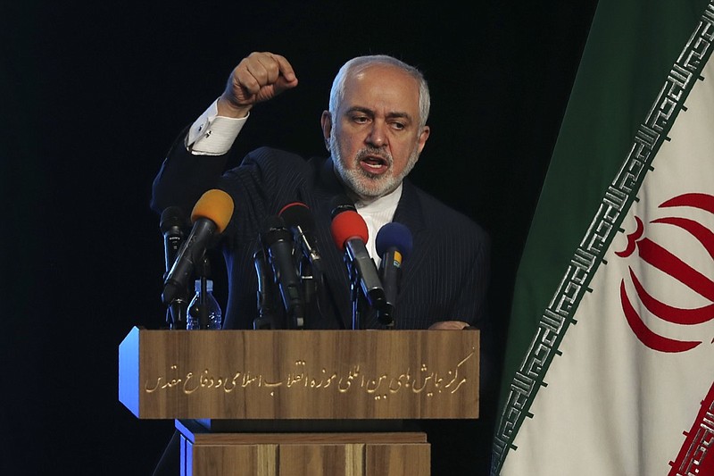 Iran's Foreign Minister Mohammad Javad Zarif addresses in a conference in Tehran, Iran, Tuesday, Feb. 23, 2021. Following the conference Zarif told journalists the country has started implementing a law passed by the parliament to curb UN inspections into its nuclear program and would no longer share surveillance footage of its nuclear facilities with the U.N. agency. (AP Photo/Vahid Salemi)
