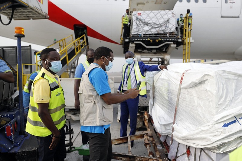 This photograph released by UNICEF Wednesday Feb. 24, 2021, shows the first shipment of COVID-19 vaccines distributed by the COVAX Facility arriving at the Kotoka International Airport in Accra, Ghana. Ghana has become the first country in the world to receive vaccines acquired through the United Nations-backed COVAX initiative with a delivery of 600,000 doses of the AstraZeneca vaccine made by the Serum Institute of India. (Francis Kokoroko/UNICEF via AP)