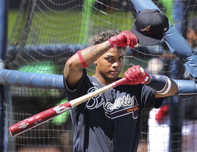 Atlanta Journal-Constitution photo by Curtis Compton via AP / Atlanta Braves outfielder Cristian Pache, shown during batting practice at spring training Wednesday in North Port, Fla., was called up late in the 2020 regular season to make his MLB debut, but he took on a bigger role during the playoffs and generated highlights at the plate and in the field.