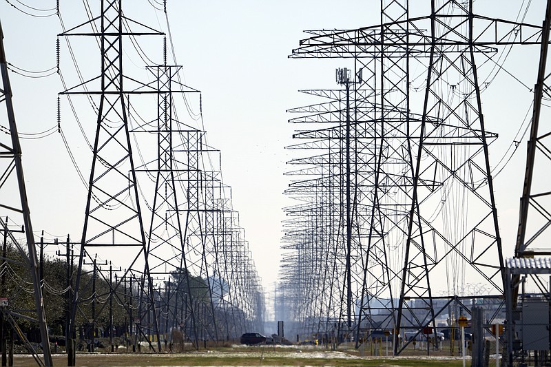 AP file photo by David J. Phillip/Power lines stretch to the horizon in Houston, Texas. Officials with the Electric Reliability Council of Texas, which operates the state's power grid, said last week that failures in natural gas, coal and nuclear energy systems were responsible for nearly twice as many outages as frozen wind turbines and solar panels combined.