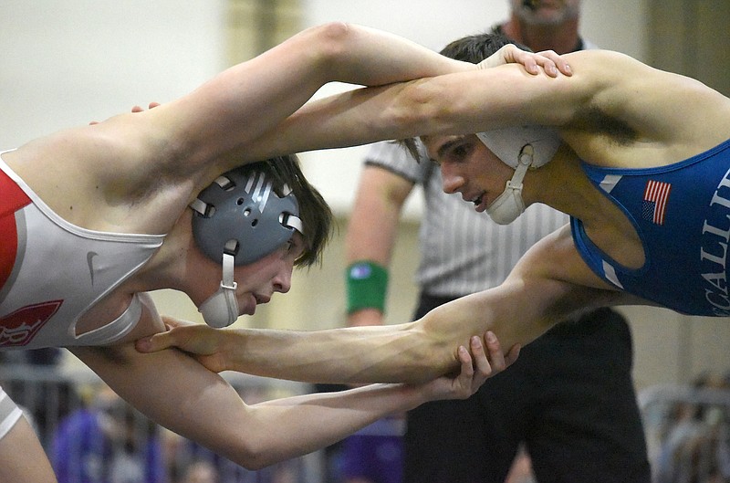 Staff photo by Matt Hamilton / Baylor's Jackson Bond, left, wrestles McCallie's Jack Braman in the 126-pound final during the TSSAA Division II state traditional tournament Thursday at the Chattanooga Convention Center.