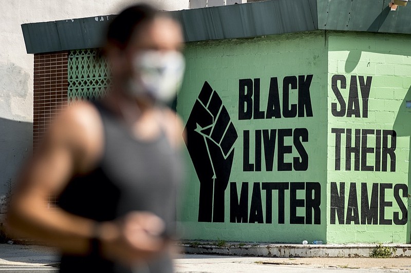 FILE - In this July 13, 2020, file photo, a black lives matter mural is visible in the Shaw neighborhood in Washington.  (AP Photo/Andrew Harnik, File)


