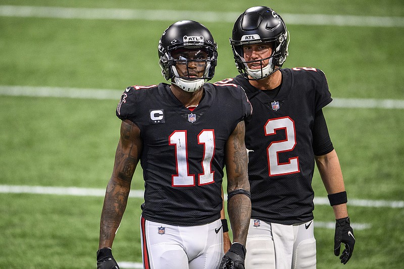 AP photo by Danny Karnik / Atlanta Falcons quarterback Matt Ryan (2) speaks with wide receiver Julio Jones during a home game against the New Orleans Saints this past December.