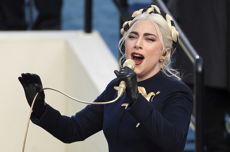 In this Wednesday, Jan. 20, 2021 file photo, Lady Gaga sings the national anthem during President-elect Joe Biden's inauguration at the U.S. Capitol in Washington. Lady Gaga's two French bulldogs, which were stolen by thieves who shot and wounded the dogwalker, were recovered unharmed Friday, Feb. 26, 2021 Los Angeles police said.(AP Photo/Saul Loeb, Pool)