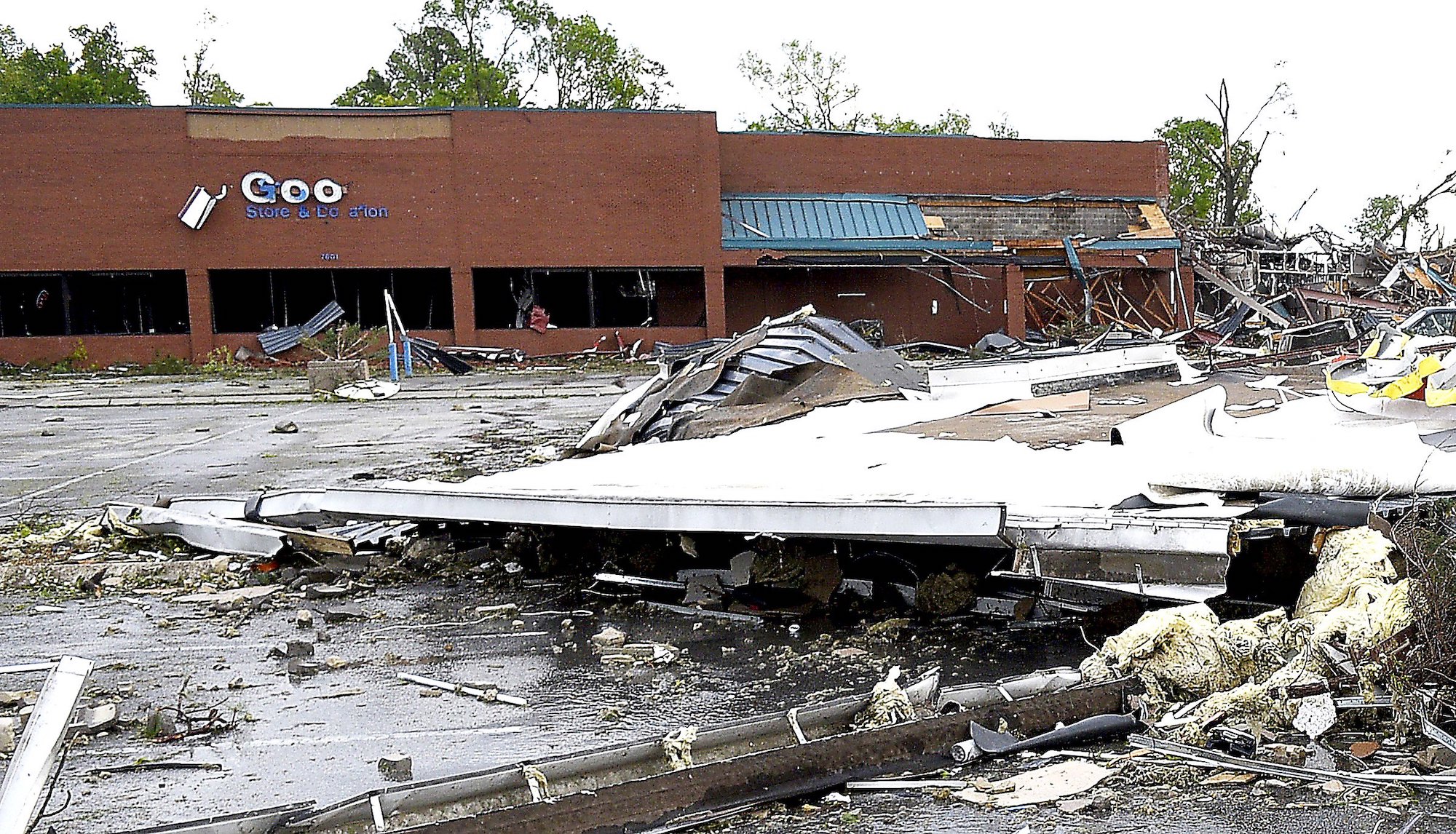 Staff Photo by Robin Rudd / A portion of the roof of the destroyed Advanced Auto Parts stores letters the parking lot of the Goodwill Store on East Brainerd Road. In the background is seen the destroyed Bones Smokehouse. The Chattanooga Area was hit by EF 3 tornado on the night of April 12, 2020.