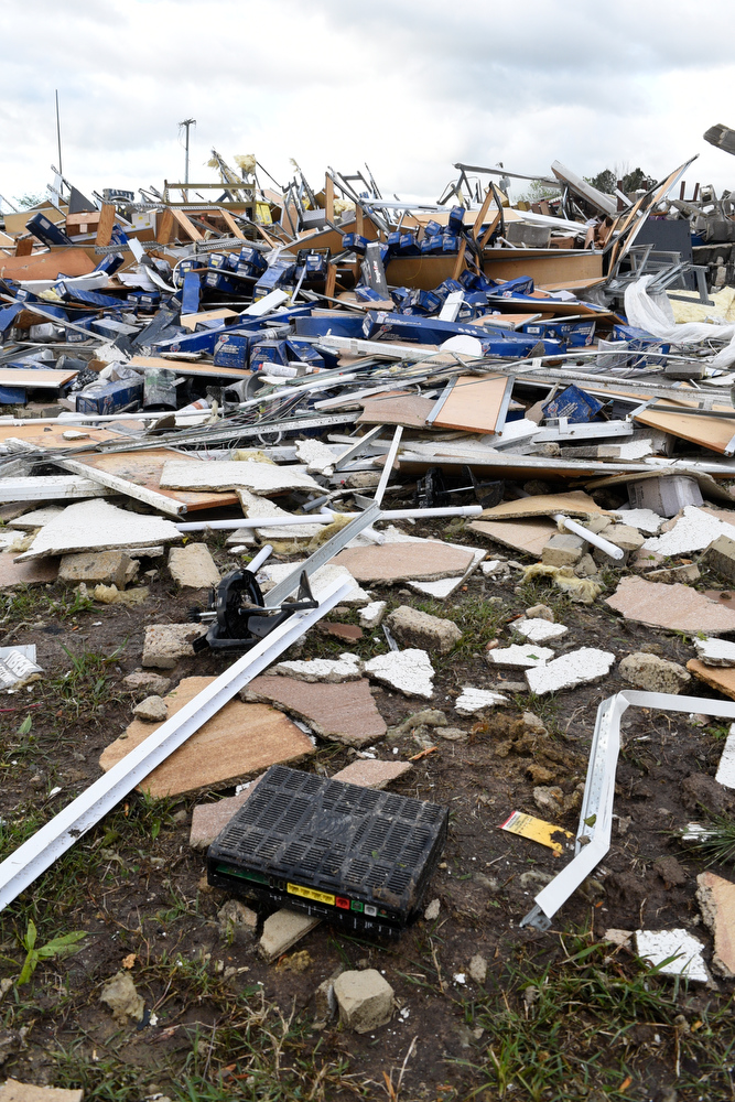 Staff Photo by Robin Rudd / Debris from the destroyed Advanced Auto Parts stores litters the grass on East Brainerd Road. The Chattanooga Area was hit by EF 3 tornado on the night of April 12, 2020. Staff Photo by Robin Rudd / The Chattanooga Area was hit by severe storms on at the night of April 12, 2020.