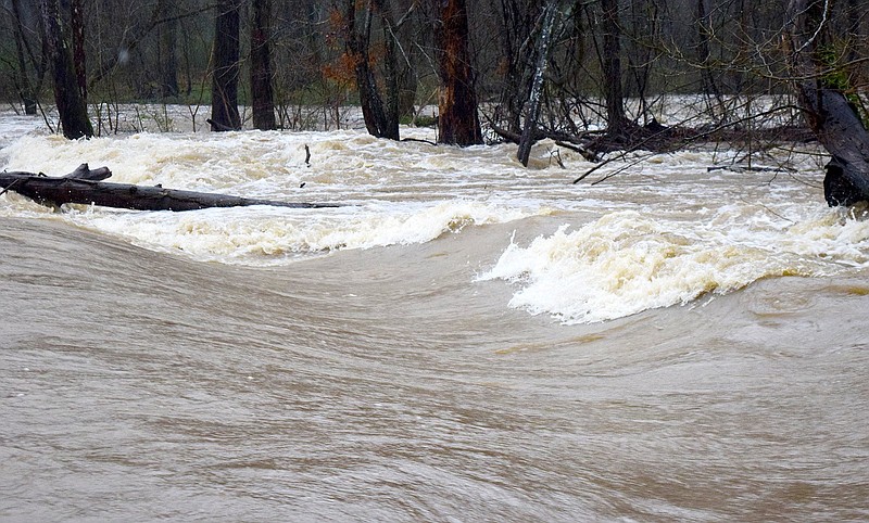 Staff Photo by Robin Rudd / The high water of South Chickamauga Creek rushes over the old dam that once served the Graysville Mill in Graysville, Georgia.  Heavy rain and flooding forced the closing of some local school systems on February 6, 2020.