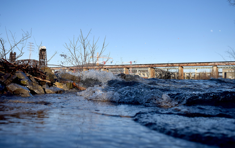 Staff Photo by Robin Rudd/ The Tennessee River sends waves onto a path, that descends from the Tennessee Riverwalk to the shore. Heavy rains are expected this weekend, so TVA is spilling water through Chickamauga Dam, on January 7, 2020, in preparation for possible area flooding.