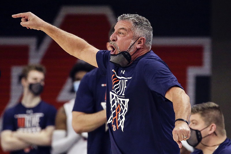 AP photo by Butch Dill / Auburn coach Bruce Pearl reacts to a call during the first half of Saturday's SEC game against visiting Tennessee. Pearl's Tigers beat the 25th-ranked Vols 77-72.