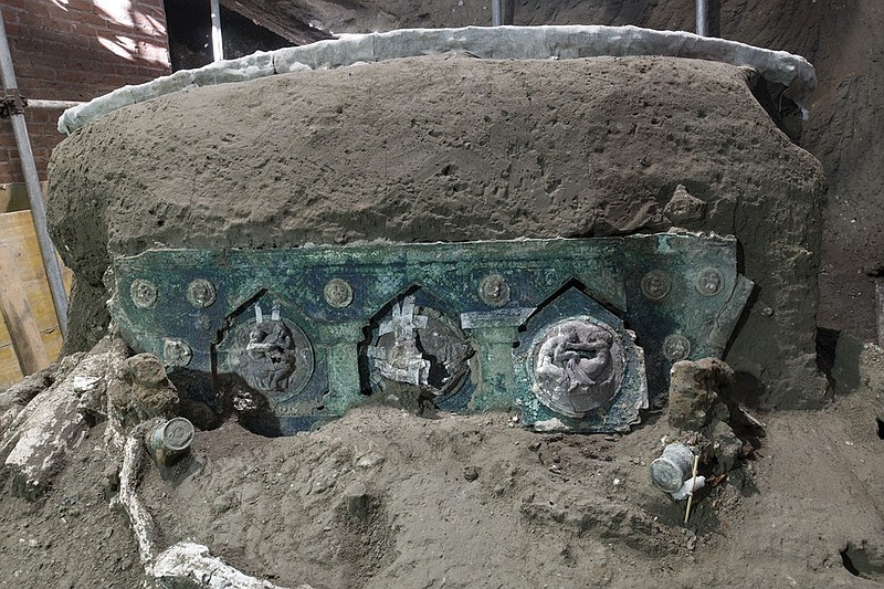 A view of a chariot, with its iron elements, bronze decorations and mineralized wooden remains, that was found in Civita Giuliana, north of Pompeii. (Parco Archeologico di Pompei via AP)


