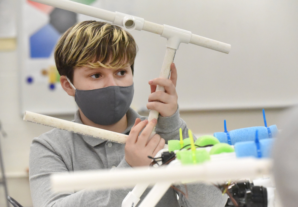 Staff Photo by Matt Hamilton / Beck Chandler, 12, works on an ROV, a remote operated vehicle, at Howard Connect Academy on Wednesday, Feb. 24, 2021.