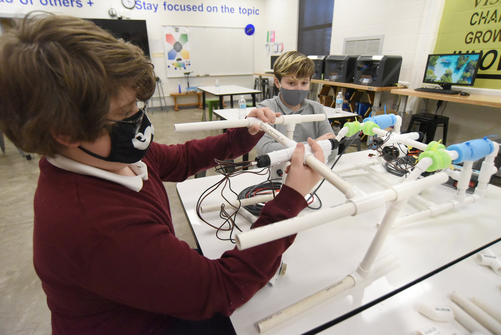 Staff Photo by Matt Hamilton / Otis Rozema, left, and Beck Chandler, both 12, work on a remote operated vehicle at Howard Connect Academy on Wednesday, Feb. 24, 2021.