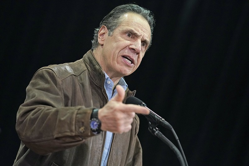 FILE - In this Wednesday, Feb. 24, 2021, file photo, New York Gov. Andrew Cuomo speaks during a press conference before the opening of a mass COVID-19 vaccination site in the Queens borough of New York. A former aide's allegations that Gov. Cuomo subjected her to an unwanted kiss during years of sexual harassment have spurred calls for an investigation — and questions about who might meaningfully conduct one. (AP Photo/Seth Wenig, Pool, File)

