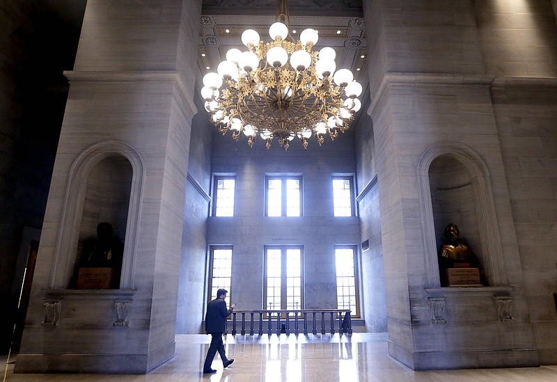 AP file photo by Mark Humphrey/A man walks through the hall outside the House and Senate chambers of the Tennessee Capitol in 2019. This year, the Senate's Republic Caucus is pressuring college and university presidents to ban student athletes' peaceful protests, an action the ACLU and others say would be unconstitutional.