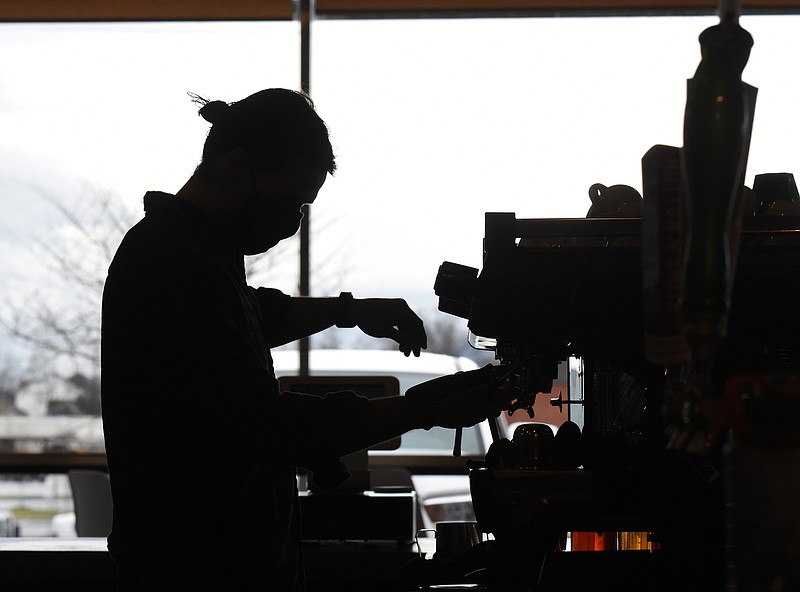 Staff Photo by Matt Hamilton / Co-owner Jacob Nelson makes a cappuccino at the Burlaep Print and Press coffee shop on Monday, March 1, 2021. 