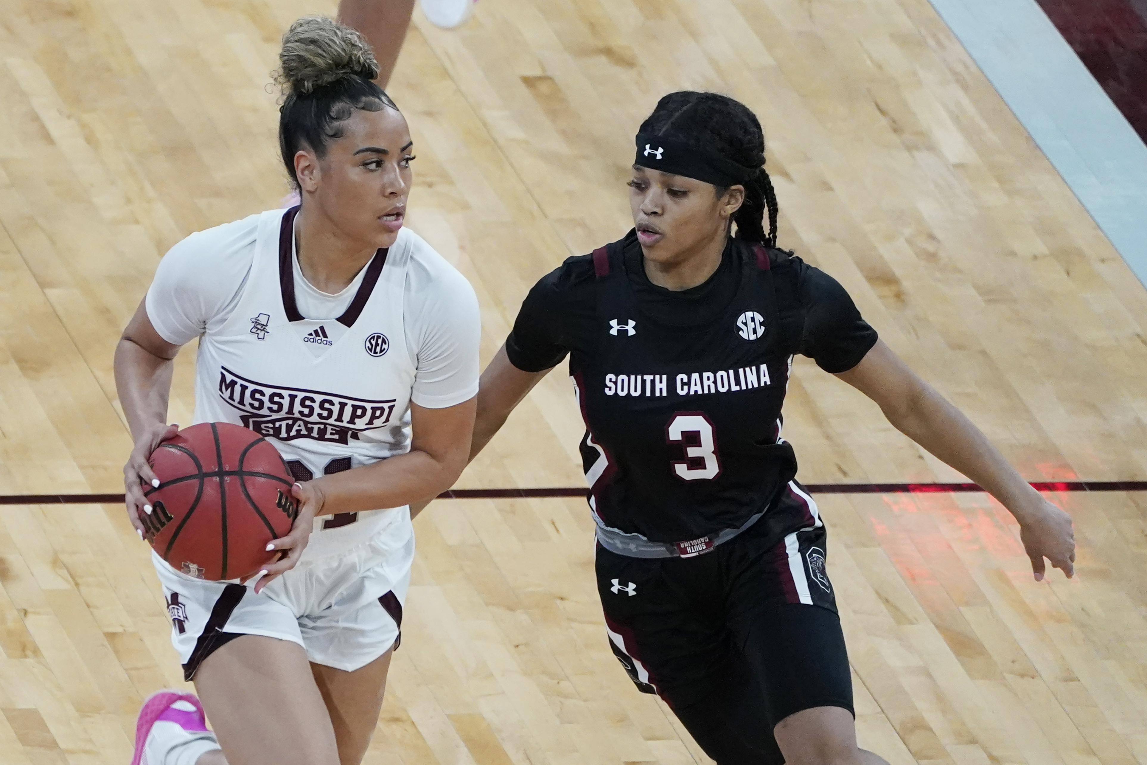 Mississippi State guard Madison Hayes (21) tries to dribble past South Carolina guard Destanni Henderson (3) during the first half of an NCAA college basketball game in Starkville, Miss., Thursday, Jan. 28, 2021. South Carolina won 75-52. (AP Photo/Rogelio V. Solis)