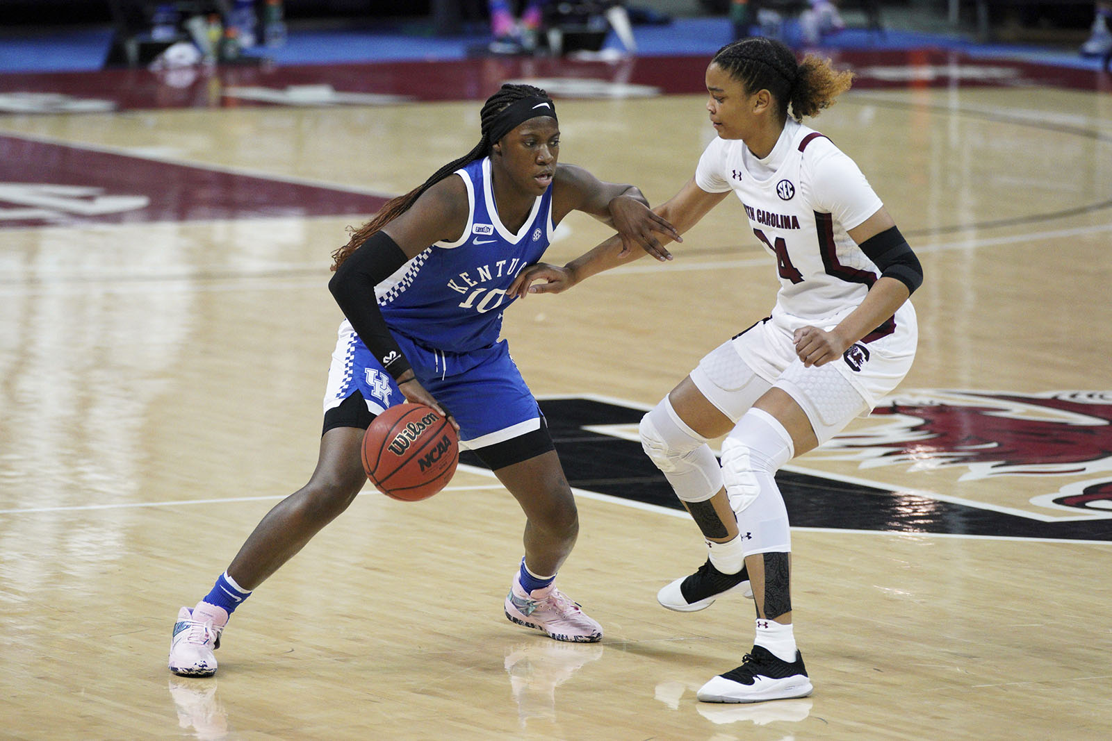 Kentucky guard Rhyne Howard (10) dribbles against South Carolina guard LeLe Grissett (24) during the second half of an NCAA college basketball game Sunday, Feb. 21, 2021, in Columbia, S.C. (AP Photo/Sean Rayford)