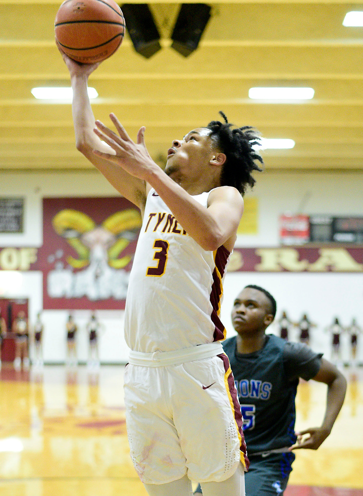 Staff Photo by Robin Rudd / Tyner's Amarion Dillard (3) scores on a layup. The Tyner Rams hosted the Red Bank Lions in the boy's TSSAA Region 3-AA Tournament Semifinals on March 2, 2021.