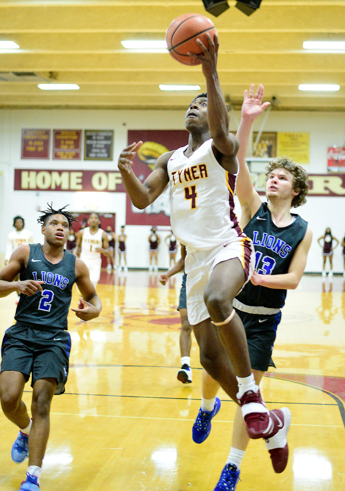 Staff Photo by Robin Rudd / Tyner's Nehemiah Bloodsaw (4) scores on a breakaway. The Tyner Rams hosted the Red Bank Lions in the boy's TSSAA Region 3-AA Tournament Semifinals on March 2, 2021.