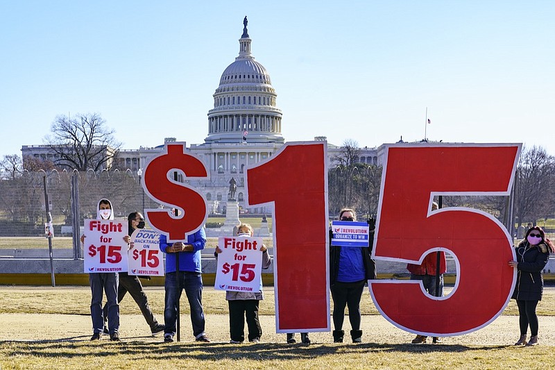 Activists appeal for a $15 minimum wage near the Capitol in Washington, Thursday, Feb. 25, 2021. (AP Photo/J. Scott Applewhite)