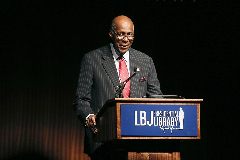 FILE - In this April 9, 2014 file photo, civil rights activist Vernon Jordan introduces former President Bill Clinton during the Civil Rights Summit in Austin, Texas. Jordan, who rose from humble beginnings in the segregated South to become a champion of civil rights before reinventing himself as a Washington insider and corporate influencer, died Tuesday, March 2, 2021, according to a statement from his daughter. He was 85. (AP Photo/Jack Plunkett, File)