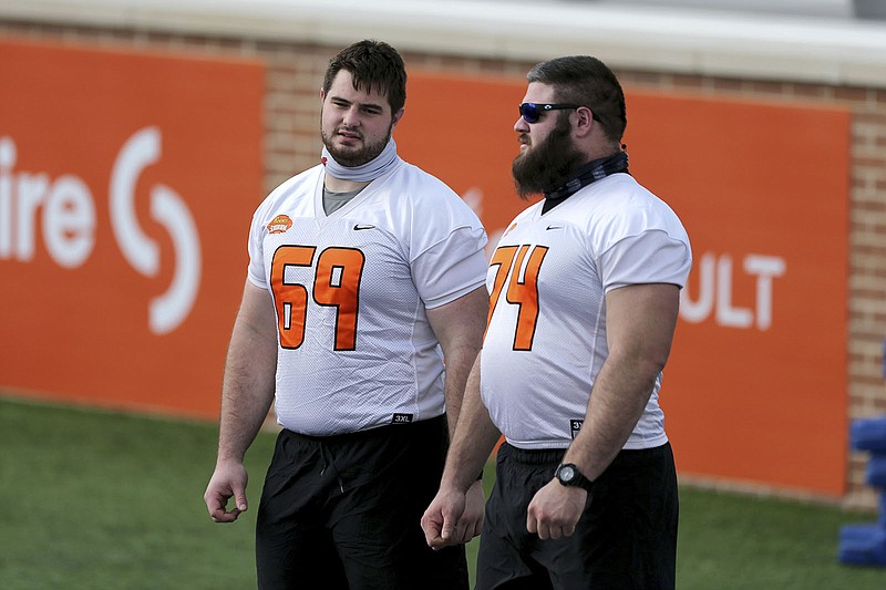 AP photo by Rusty Costanza / Alabama's Landon Dickerson, left, and Georgia's Ben Cleveland, shown Jan. 27 in Mobile, Ala., during a practice for the Senior Bowl, are among the offensive lineman who would have received invitations to the NFL combine this winter had the event not been canceled.