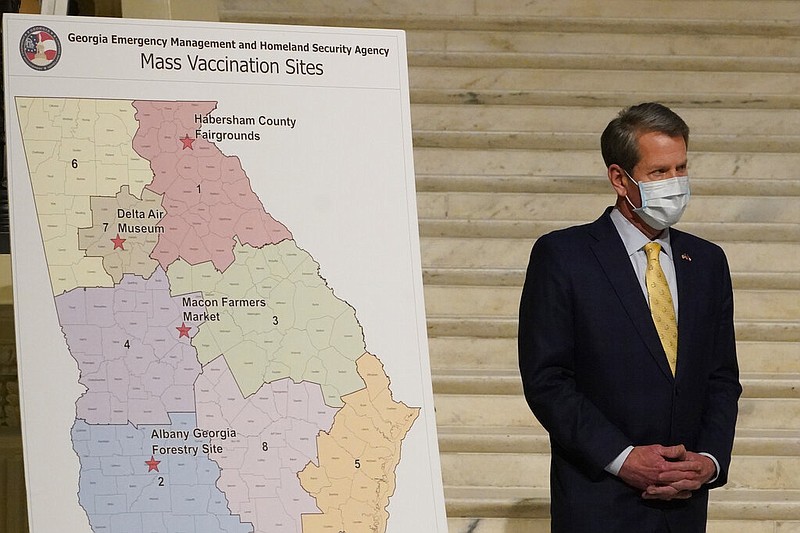 Georgia Gov. Brian Kemp answers questions during a news conference to discuss the state's COVID-19 vaccine distribution plans, Thursday, Feb. 18, 2021, in Atlanta. (AP Photo/John Bazemore)