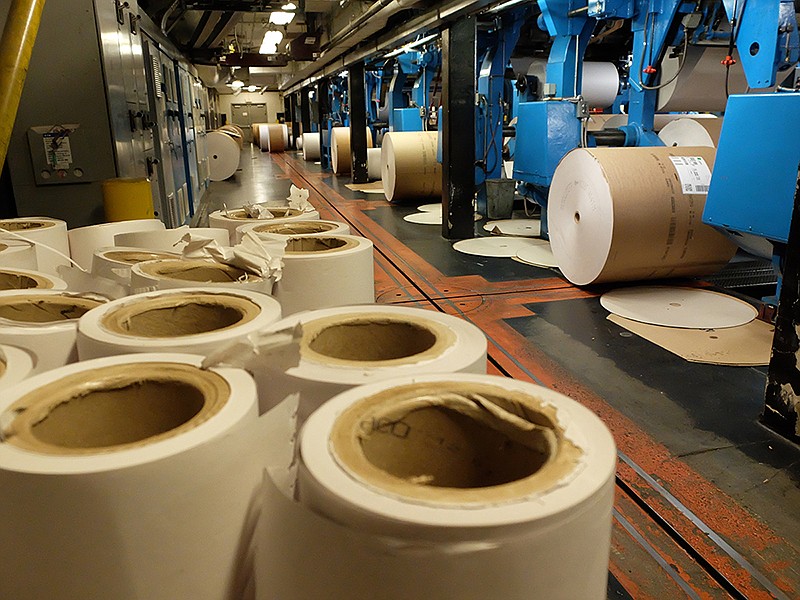 Staff File Photo / Used newspaper rolls stand on end at the Chattanooga Times Free Press as new rolls are put in place for press production.