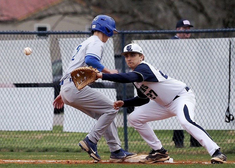 Staff photo by C.B. Schmelter / Ringgold's Isaac King safely gets back to first base as Gordon Lee's Jake Poindexter goes for the ball during Friday's nonregion game at Claud Hendrix Field in Chickamauga, Ga. Gordon Lee won 13-3.