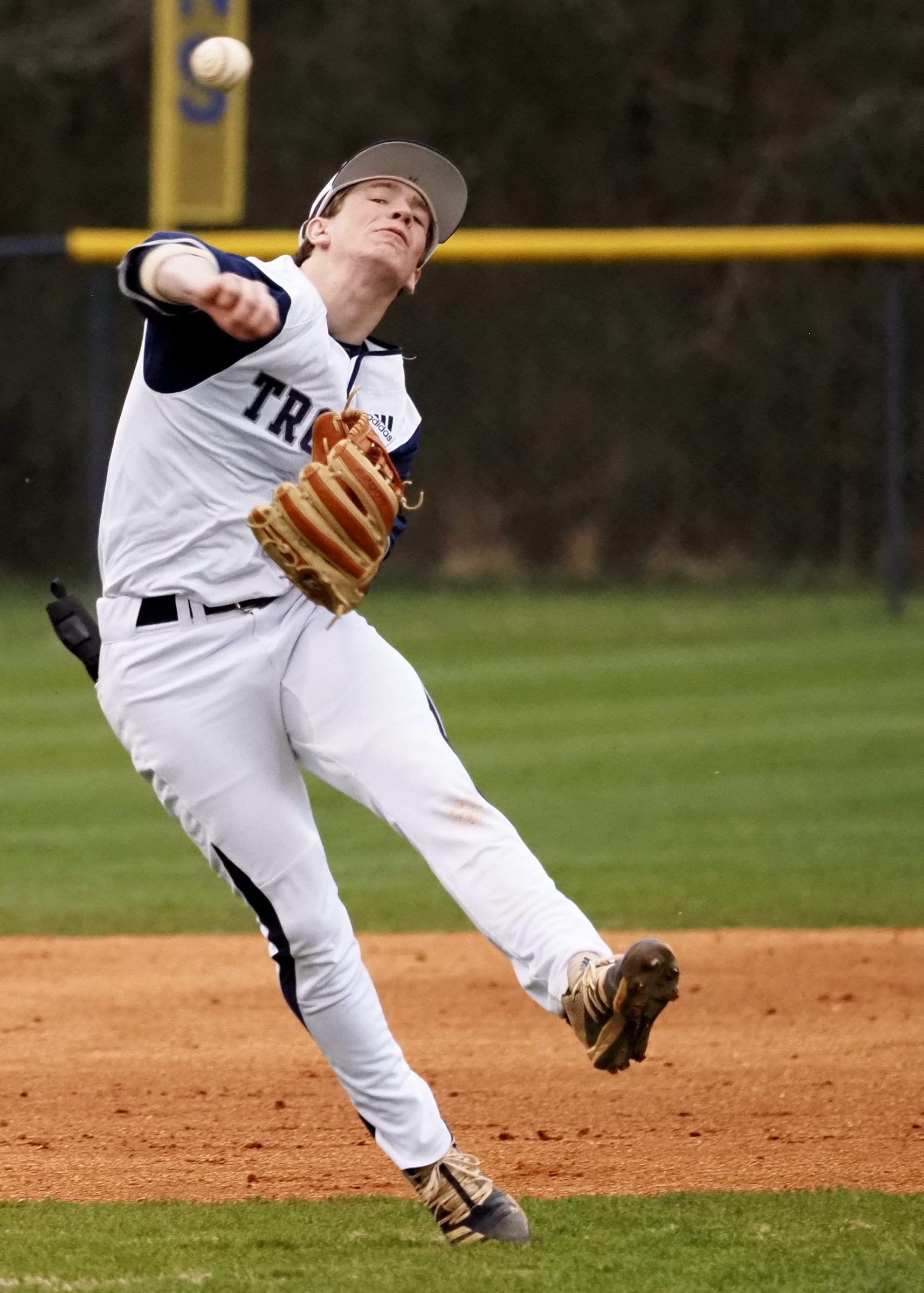 Staff photo by C.B. Schmelter / Gordon Lee's Kade Cowan throws to first base against Ringgold at Gordon Lee High School's Claud Hendrix Field on Friday, March 5, 2021 in Chickamauga, Ga.