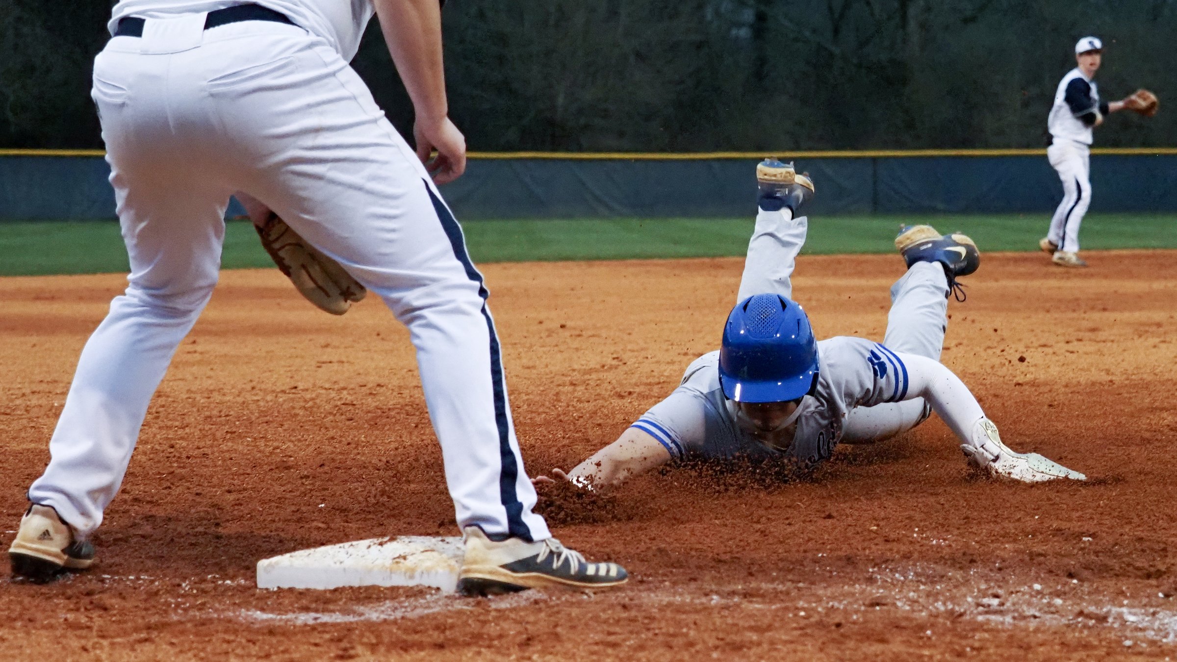 Staff photo by C.B. Schmelter / Ringgold's Colin Mountjoy safely slides into third base against Gordon Lee at Gordon Lee High School's Claud Hendrix Field on Friday, March 5, 2021 in Chickamauga, Ga.