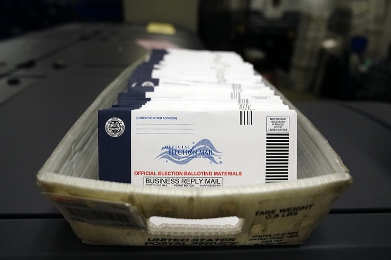 FILE - In this Oct. 23, 2020, file photo mail-in ballots for the 2020 General Election in the United States are seen before being sorted at the Chester County Voter Services office in West Chester, Pa. (AP Photo/Matt Slocum, File)


