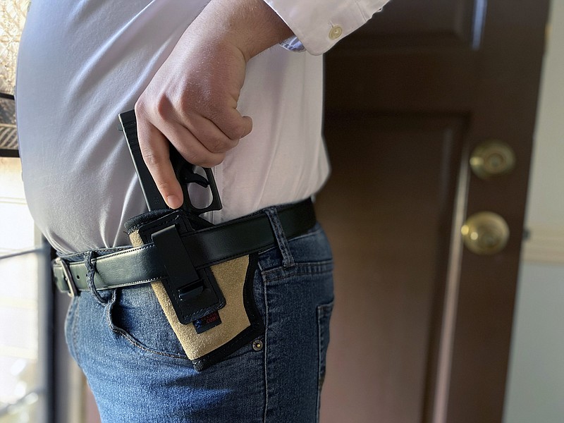 A man is seen with a gun and holster. / Photo taken Feb. 3, 2021, in Memphis, Tennessee, by Karen Pulfer Focht.