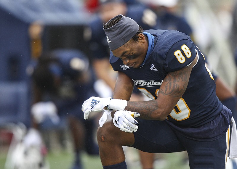 Staff file photo by Troy Stolt / UTC tight end Juwan Tyus (88) scored a 75-yard touchdown on a pass from Drayton Arnold for the first points of Saturday's 29-28 overtime victory at The Citadel. Arnold's pass came on UTC's first play from scrimmage.